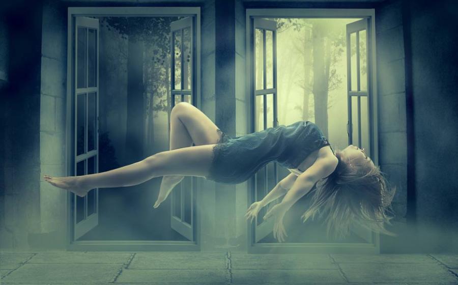 Young woman levitating