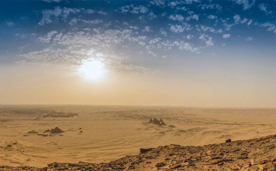 Archaeological site Jabal Maragha in Sudan has been destroyed by industrial-scale looting. Illustrative image from Jebel Bakal across the Sudanese desert with the pyramids. Source: Frank / Adobe Stock