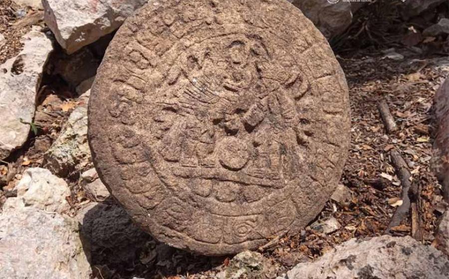 Archaeologists unearthed a stone commemorative disc featuring images of contestants in a Maya ball game at Chichén Itzá in Mexico. Source: INAH