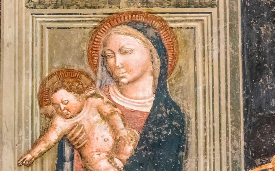Fresco depicting the Virgin Mary holding Baby Jesus. Source: Giorgio G / Adobe Stock.