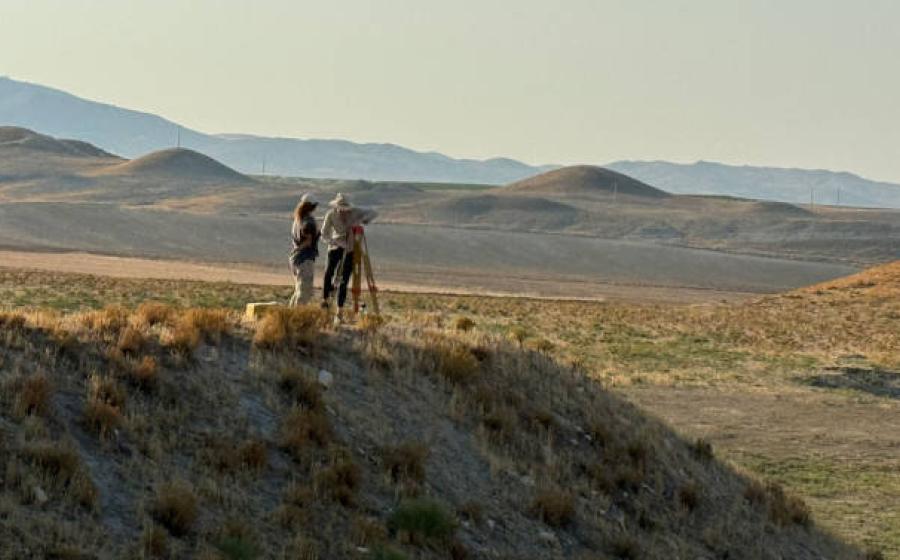 The researchers studying the mounds near the citadel of Gordion, Turkey.