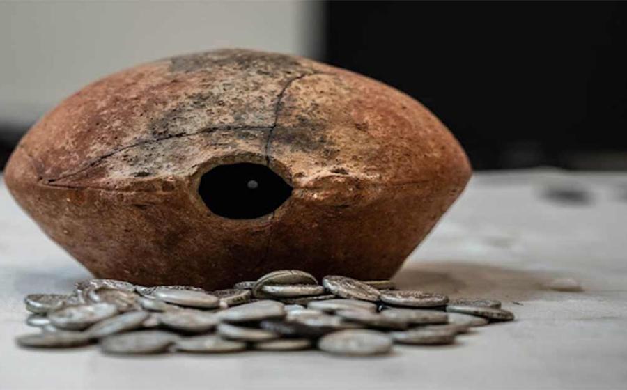The 300-BC Mleiha silver coin hoard and the ancient jar it was found in. Source: Sharjah Archaeology Authority