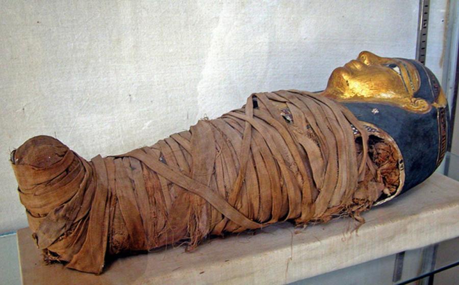 Mummy of a child with a gilded face mask. Greco-Roman Museum, Alexandria, Egypt. Representational image only.