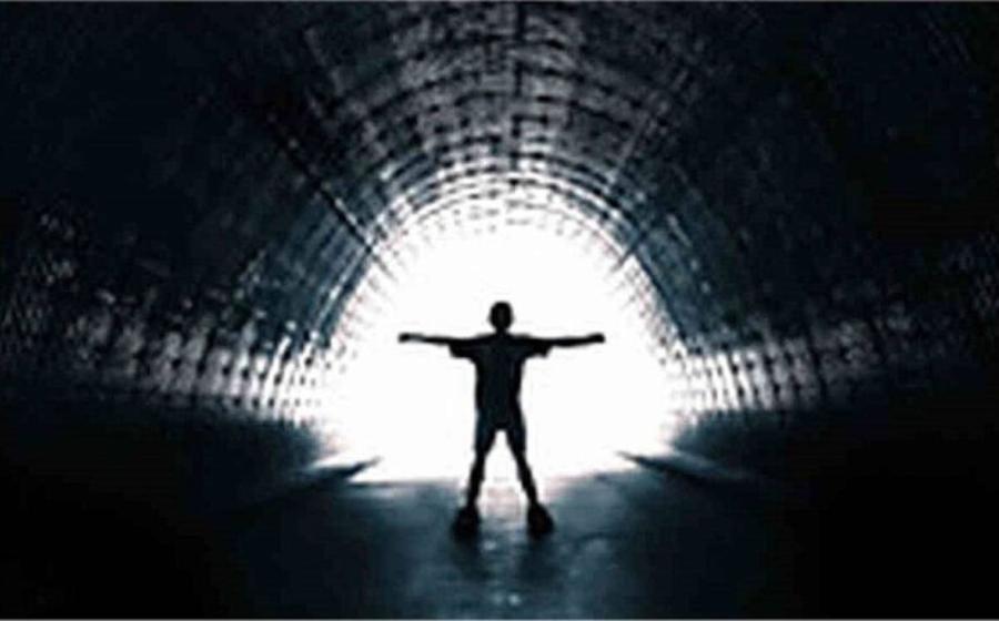 Deceased person entering the tunnel with the white light at the end that is so frequently reported during near-death experiences.