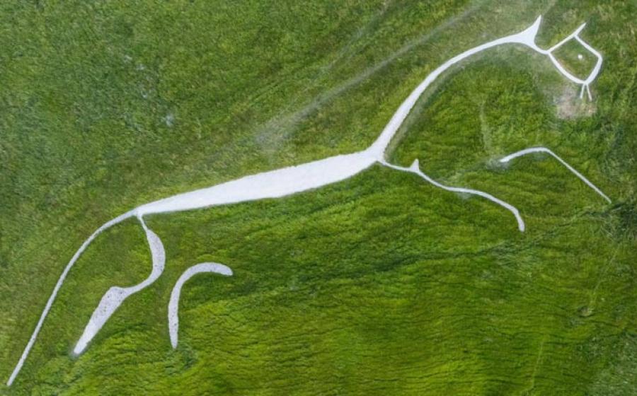 ational Trust Uffington White Horse after a phase of refurbishment where erosion and bad weather have caused shrinkage of the Bronze Age chalk carving over the decades. The artwork measures 111-metres long from head to tail and depicts a white horse near the Oxfordshire village of Uffington.	Source: BBC/ PA Media