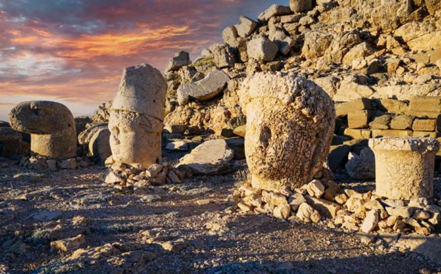 Nemrut Mountain at 2150 meters with colossal statues, and stone heads. A UNESCO World Heritage site. Anatolia, modern day Turkey. 	Source: Bulent/Adobe Stock