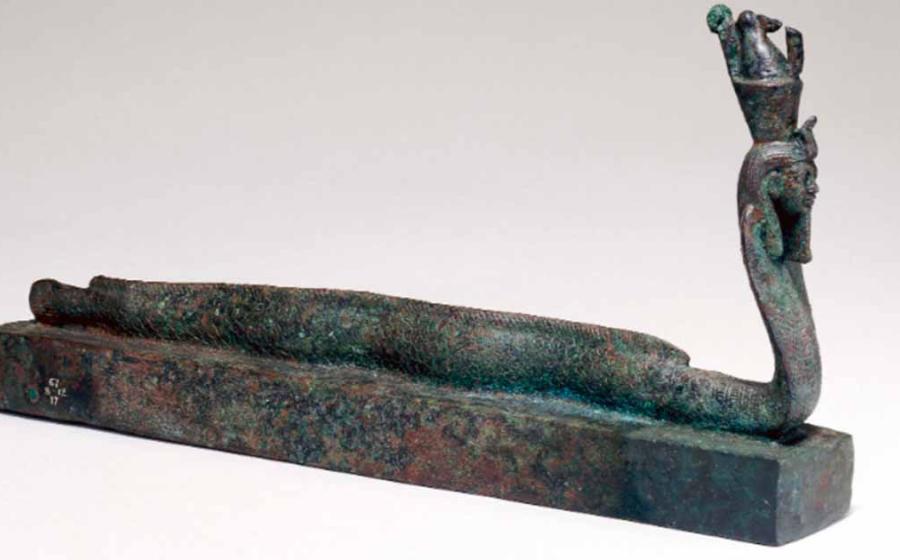 Animal coffin EA36151, surmounted by a human-headed part-eel, part-cobra creature wearing a double crown, associated with the ancient Egyptian god Atum. Source: The Trustees of the British Museum/Nature