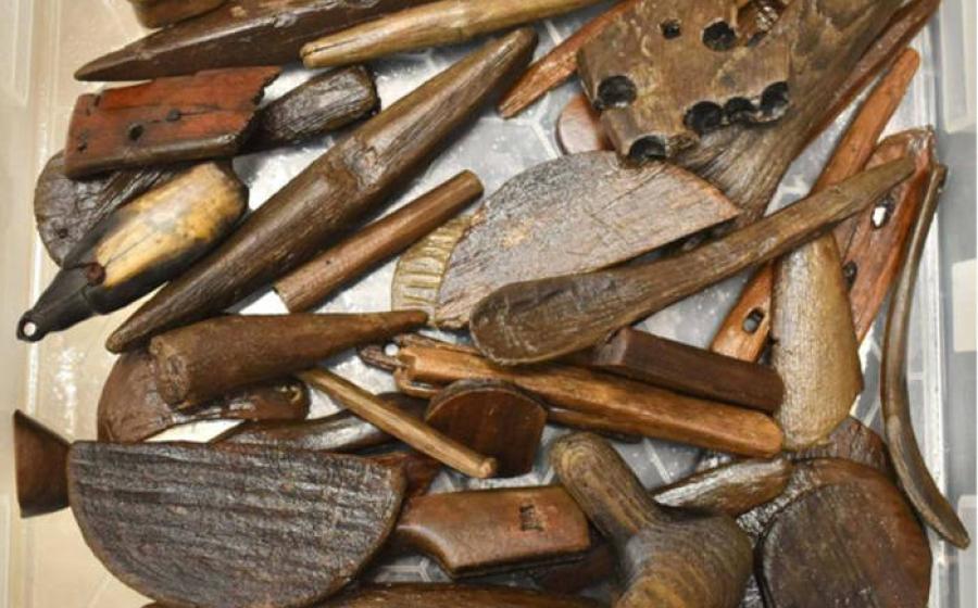 Various tools, utensils and other artifacts that were recovered after the Typhoon Halong scattered them from a significant Yup'ik archaeological site.