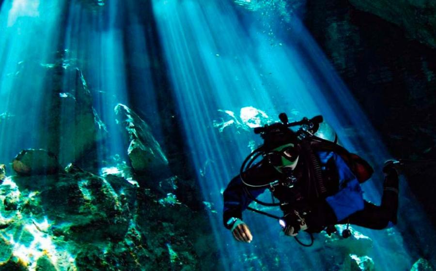 Diver in a cenote in Mexico. Public Domain.