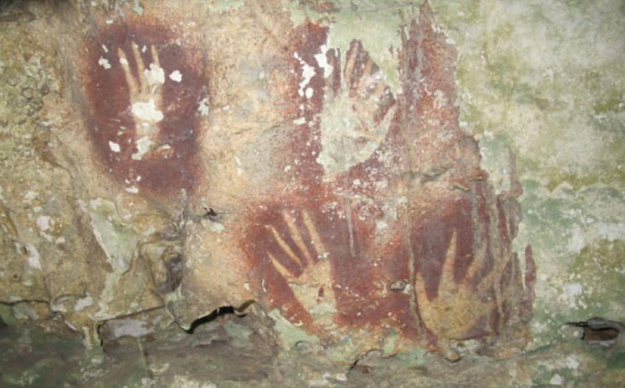 Hand print art in red found in a Sulawesi cave.