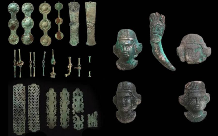 Bronze ritual artifacts including horse gear and ornamental plaques from the 4th-century BC sacrificial complex discovered at Vysokaya Mogila-Studenikin Mar, Orenburg Region.  