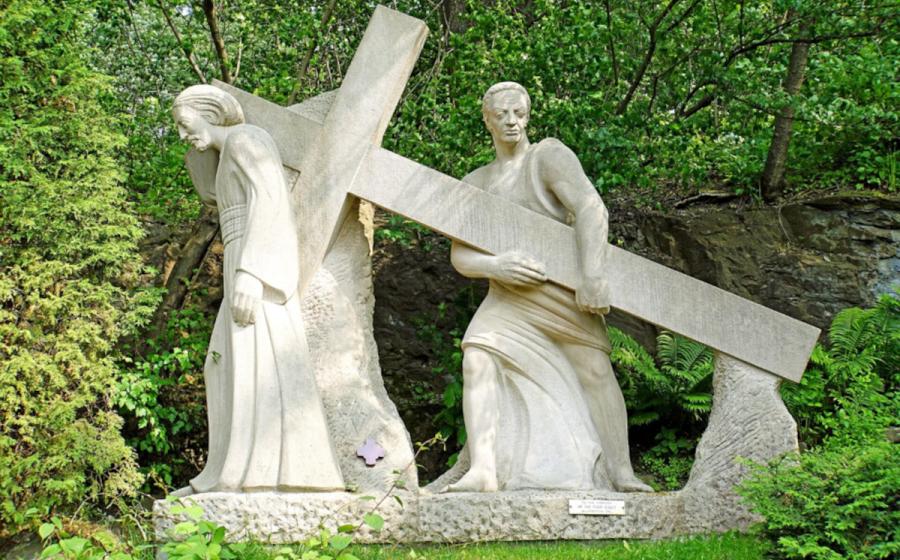 Fifth Station sculpture of Simon of Cyrene helping Jesus carry the cross. 