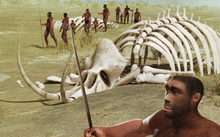 A tribe of human ancestors, Homo erectus, wanders through the savannah past mammoth skeletons. Source: ratpack223/Adobe Stock)