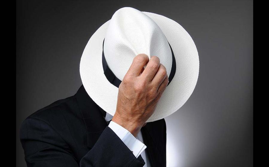 Man wearing iconic “Panama hat,” which is actually an Ecuadorian toquilla or Montecristi hat. Source: Steve Cukrov / Adobe Stock 