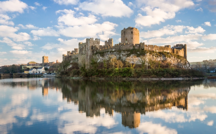 Pembroke Castle in Pembrokeshire, Wales. Archaeologists from the University of Aberdeen are excavating Wogan Cavern beneath the medieval fortress, where preserved sediments contain evidence of human occupation and environmental change stretching back more than 100,000 years