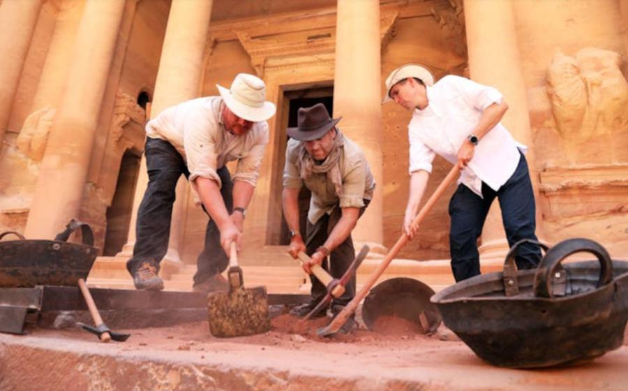 Josh Gates and Pearce Paul Creasman with archaeologist Matthew Vincent, in front of the Treasury at Petra