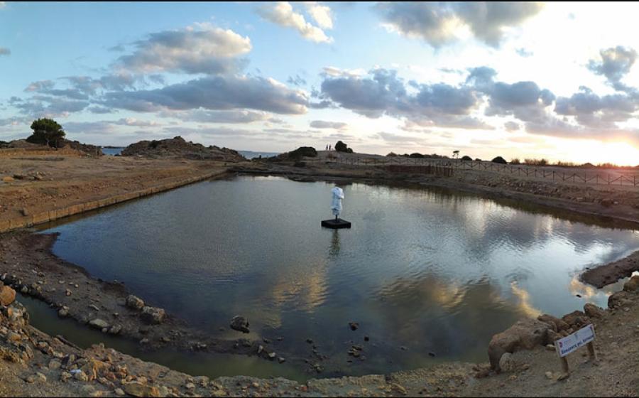 Protruding ledge M.4555 (see Figure 4), roughly at the mid-point of the northern side of the ‘Kothon’; viewed from the west.		Source: © Sapienza University of Rome Expedition to Motya / Antiquity Publications Ltd View of the refurbished ‘Kothon’ with a replica of the statue of Ba’al at its center (© Sapienza University of Rome Expedition to Motya / Antiquity Publications Ltd).
