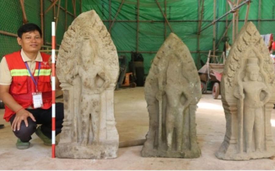 Three of the 12 statues recently recovered during excavations at Angkor Thom. 