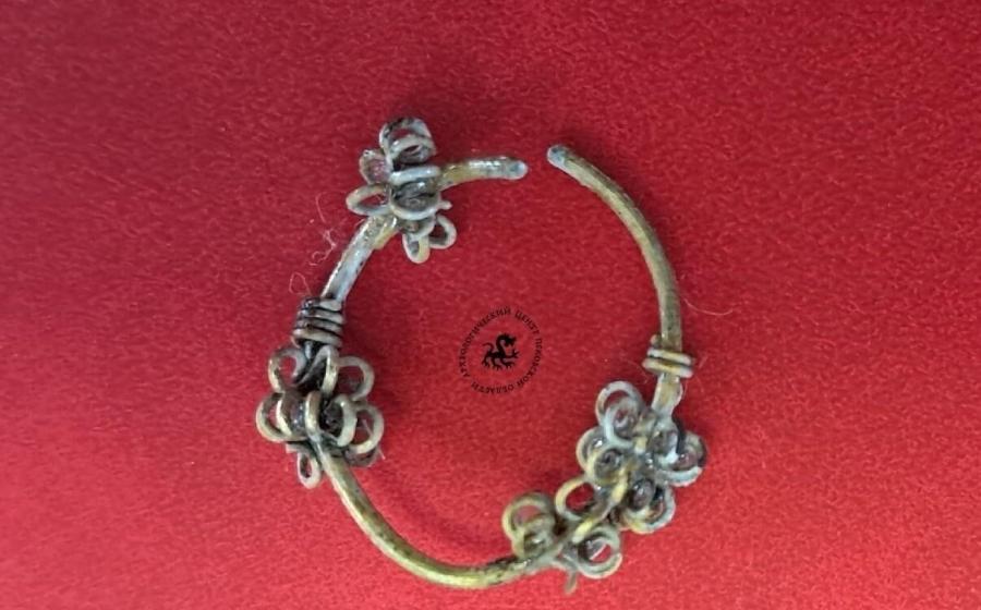Rare Balkan-style silver temple ring excavated at the Olginsky-10 site in Pskov, Russia
