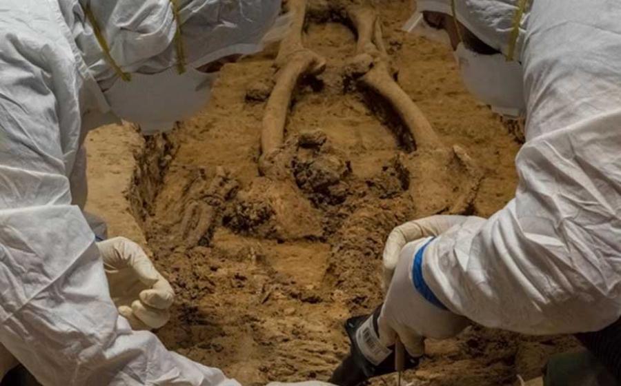 Archaeologists Mary Anna Hartley (left) and Bob Chartrand excavating the bones they believe belong to Gov. George Yeardley.