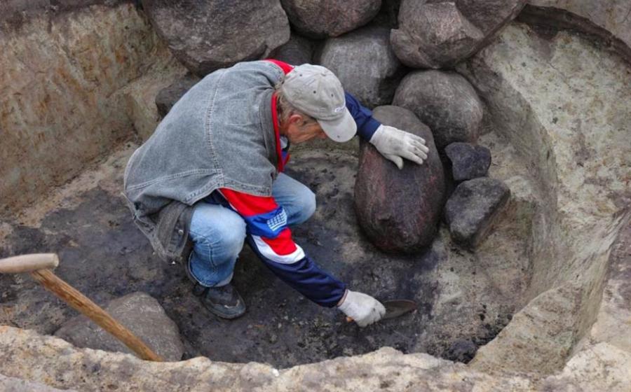 An archaeologist at work in a Roman-era necropolis in Poland 