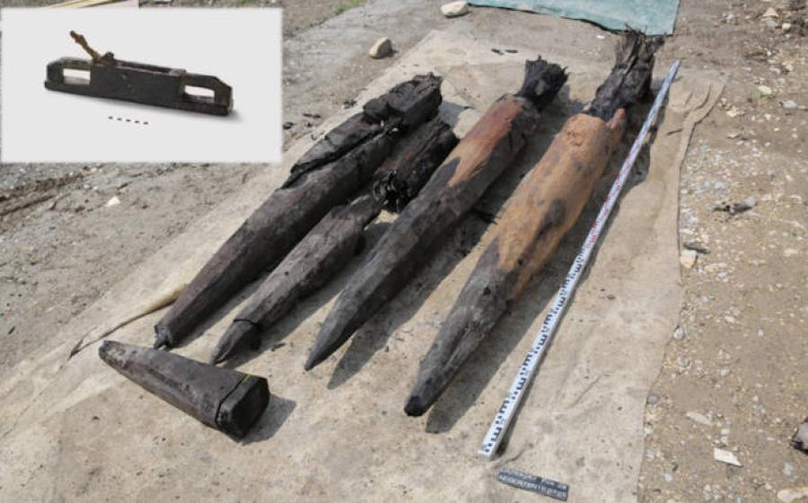 Dense oak piles from Roman bridge construction at Aegerten, Switzerland, with inset, Roman plane also found.