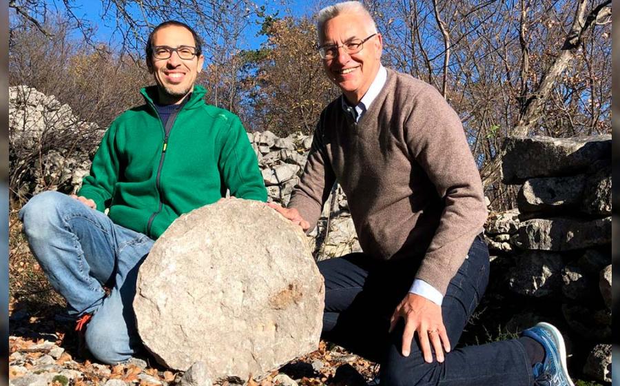 (Left to Right), archaeologist Federico Bernardini and astronomer Paolo Molaro at Castelliere di Rupinpiccolo, holding what could be the oldest celestial map ever discovered. Source: INAF
