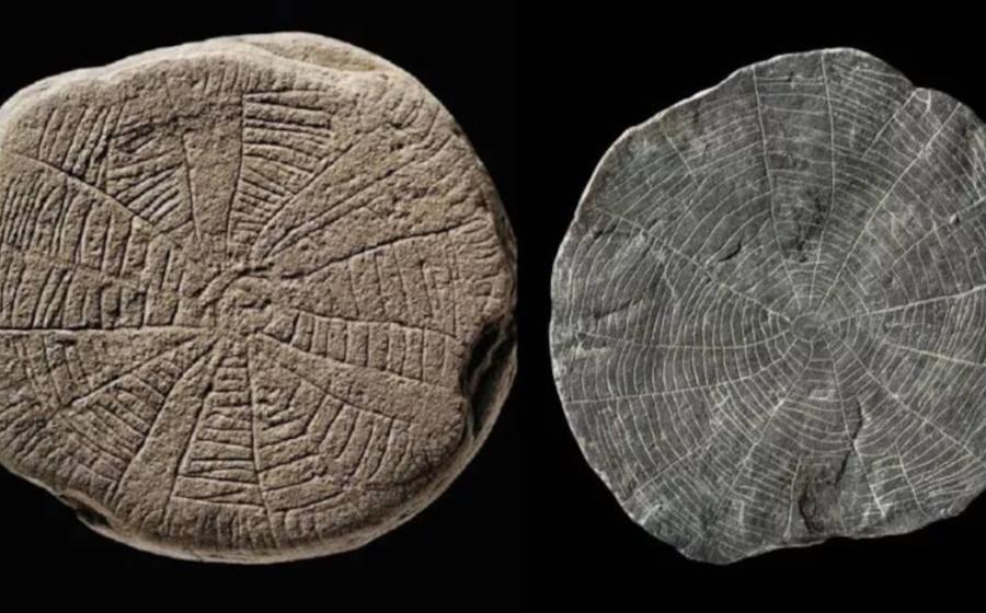 Two sun stones found on the Danish island of Bornholm in the Baltic Sea. The prehistoric artifacts are small, flat, shale pieces with finely incised patterns and sun motifs.