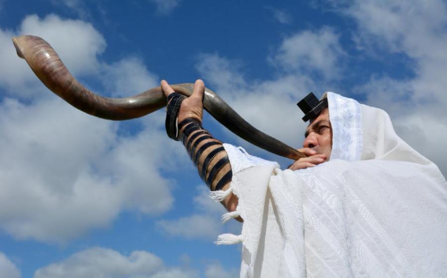 A shofar is sounded under the light of the sun. Source: Rafael Ben-Ari /Adobe Stock.