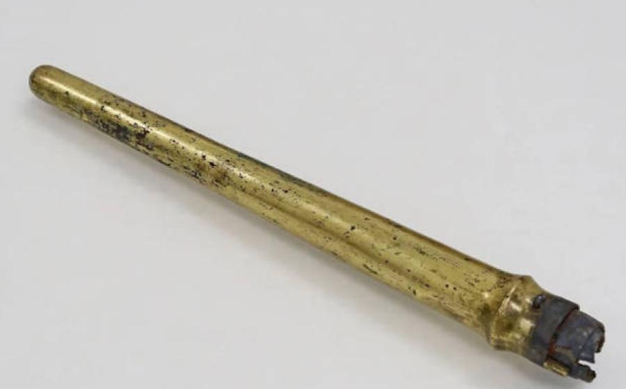 Gilt bronze spear sheath containing iron spear.