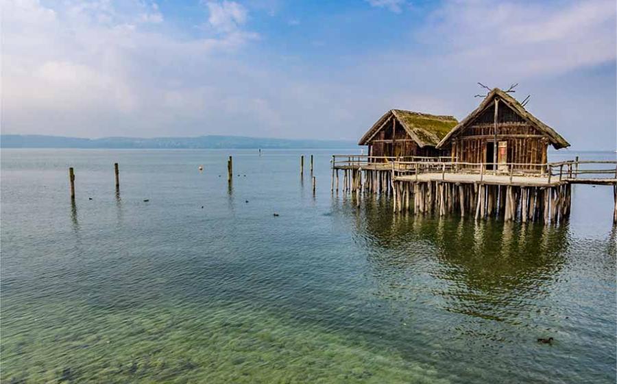 Reconstruction of ancient stilt houses. Source: Takashi Images / Adobe Stock.