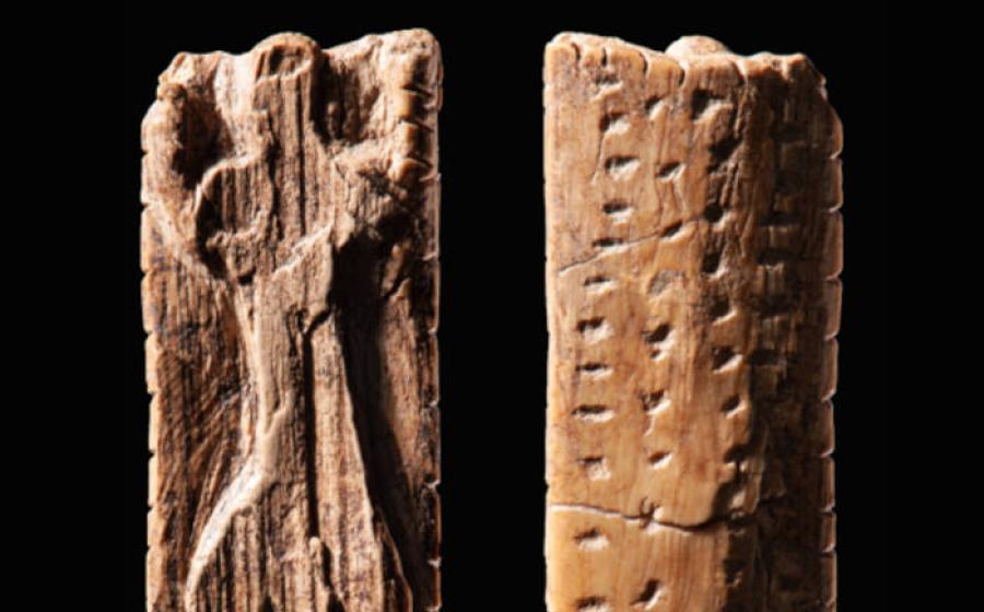 The mammoth figurine from Vogelherd Cave, approximately 40,000 years old, bearing multiple sequences of crosses and dots.