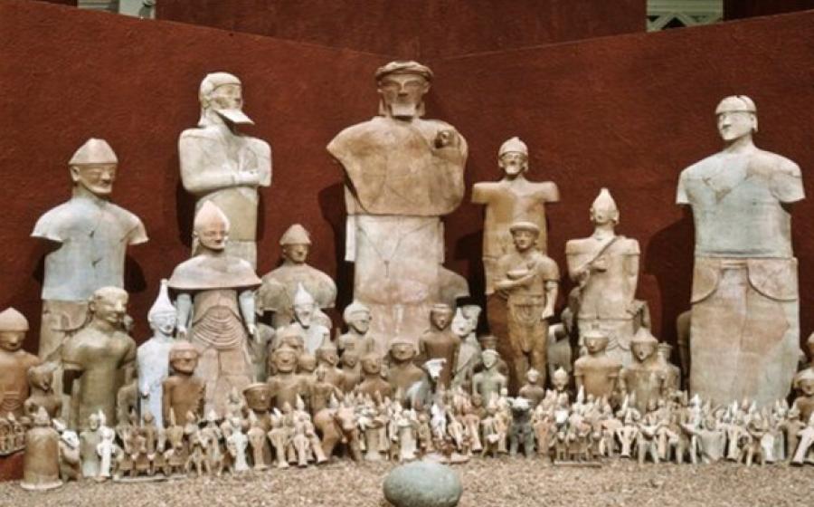 Photograph from one of the Cyprus Exhibitions at Medelhavsmuseet with the terracotta sculptures and the betyl (stone) from Agia Eirini.	