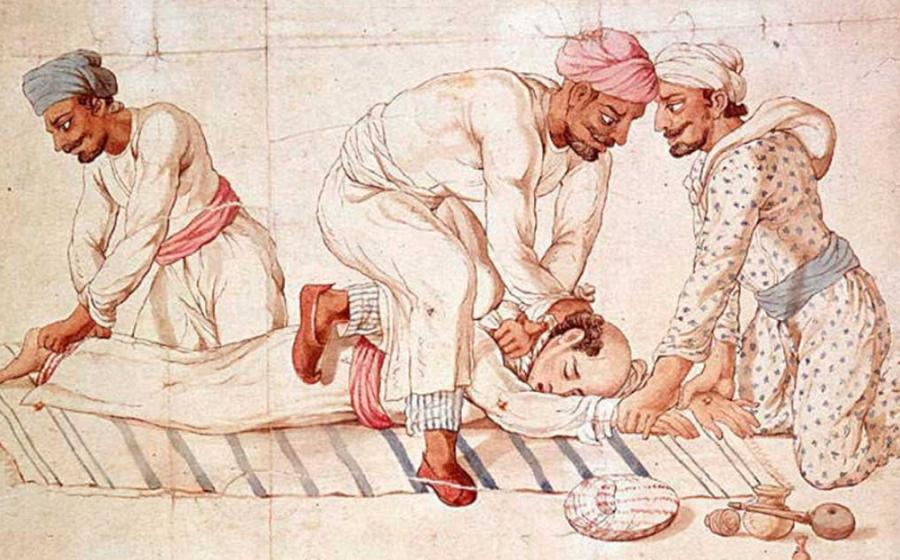 A group of Thuggees strangling a traveler on a highway in India in the early 19th century. Source: Public domain