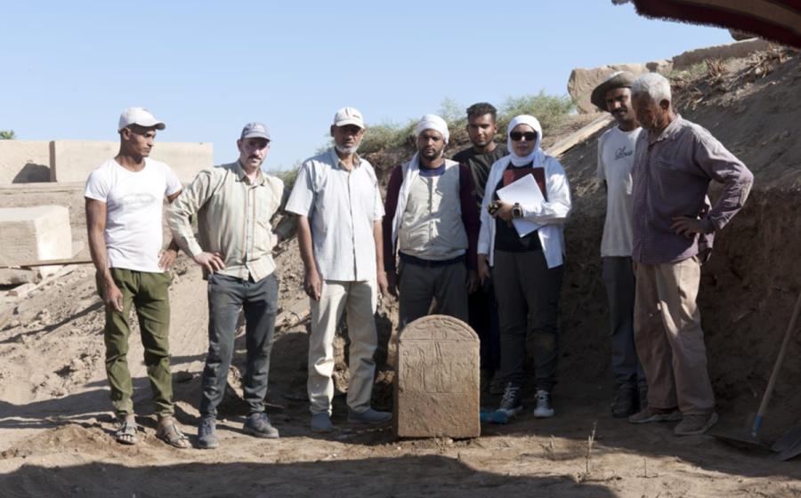 The Tiberius stele found at Karnak with some of the researchers on the project.