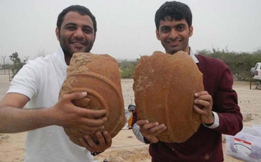 Ali Al Meqbali and Abdulla Al Kaabi with Dilmun storage jar fragments unearthed from Sir Bani Yas.