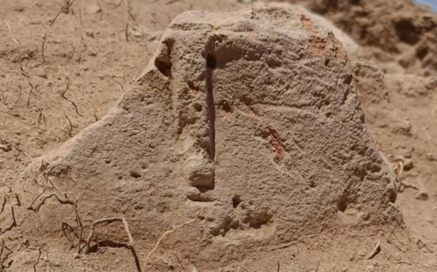 Stone idol with carved human facial features in situ in Armenia.