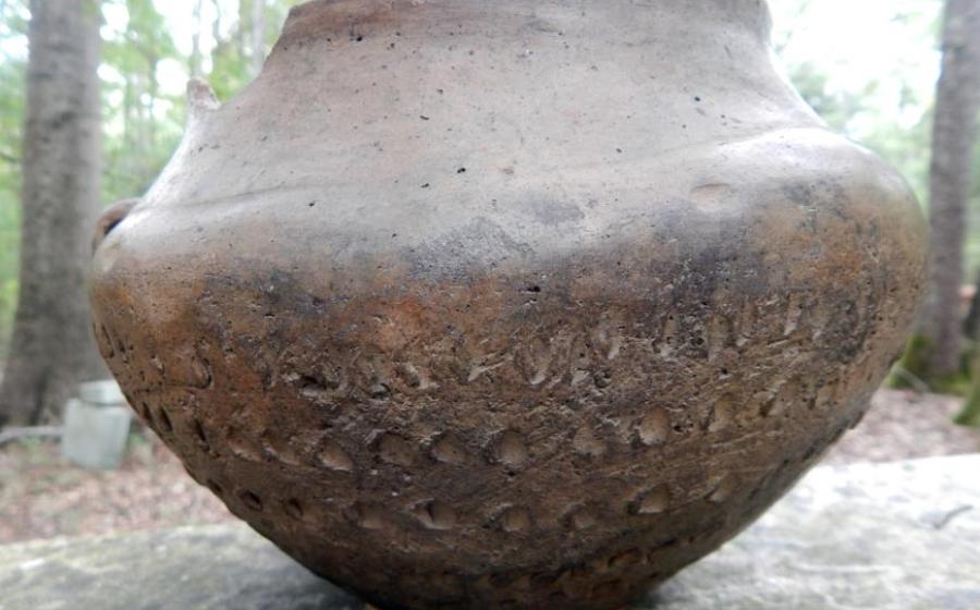 Bronze Age pot of the proto-Celtic Urnfield culture, sporting ritualistic symbols and mathematical markings. 
