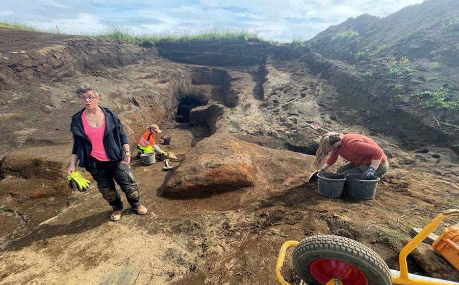 Archaeologist Kristborg Þórsdóttir standing at the site of the vast system of Viking era caves.  Source: Sigurjon Olason / Visir