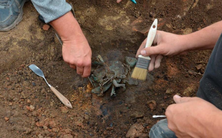The moment of the discovery of the wind chime in Viminacium.  Source: Ilija Danković, Archaeological Institute