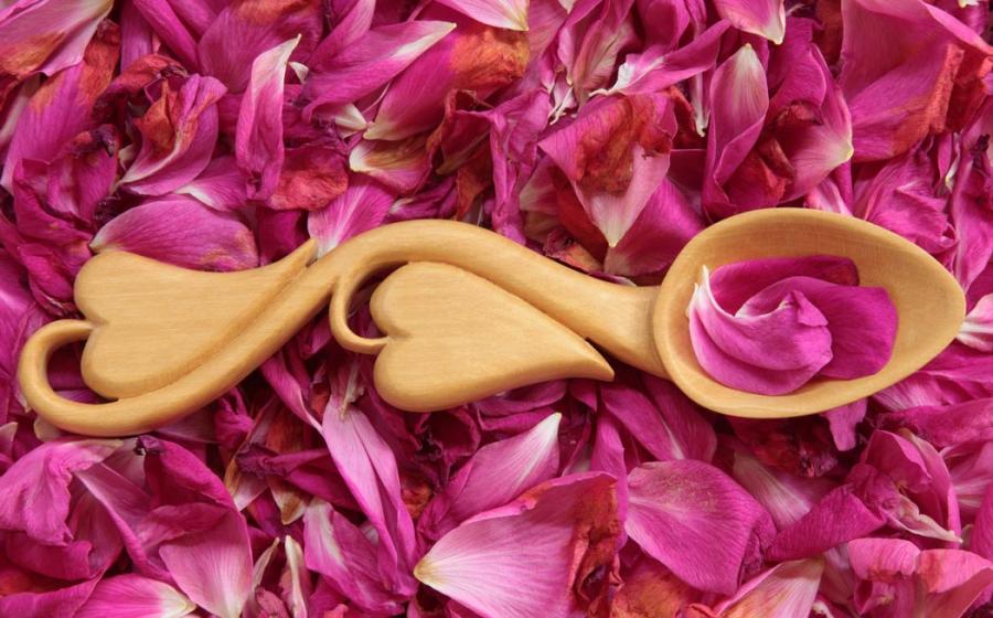 Modern Welsh love spoon on flower petals