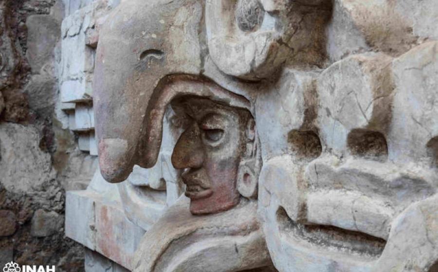 Close up of owl beak over a face above the entrance to the Zapotec tomb found in Mexico
