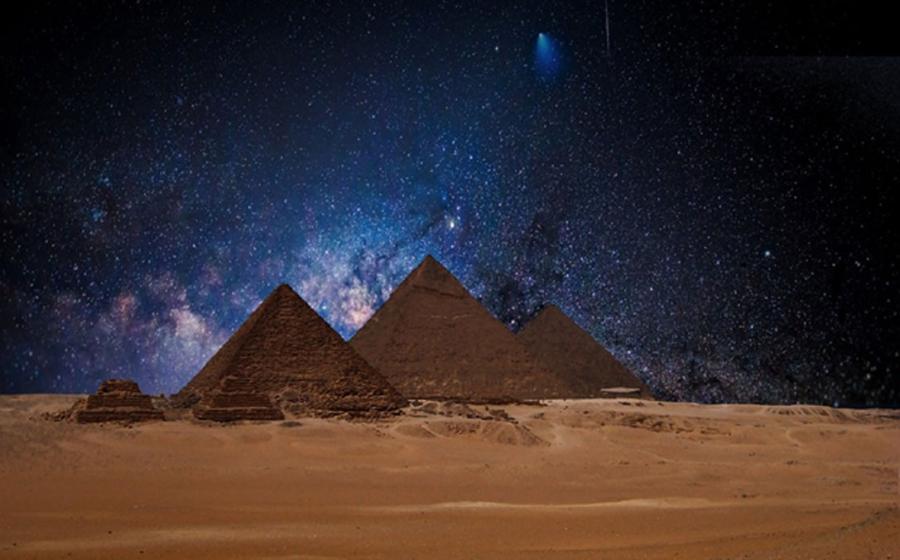 Egyptian pyramids under a night sky. Several researchers believe astronomical alignments at this site point to signs of an ancient advanced civilization.