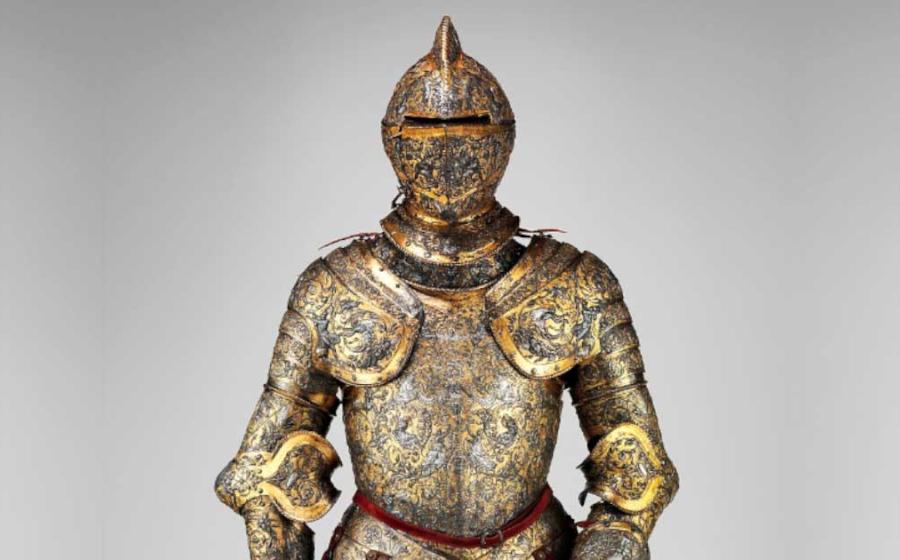 The armor of Henry II, King of France, ca. 1555 AD. This is one of the most elaborate and complete French parade armors. The surfaces are covered by dense foliate scrolls inhabited by human figures and a variety of creatures that derive from the Italian. Weight: 53 lb. 4 oz. (24.20 kg). Source: The Metropolitan Museum of Art, Public Domain.