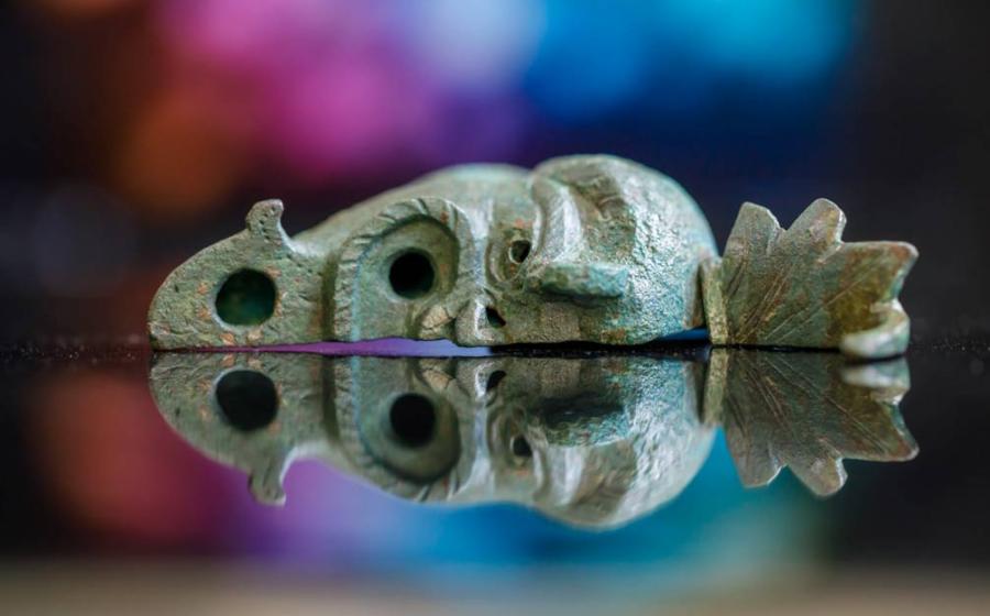 Photograph showing the bronze oil lamp unearthed in Jerusalem