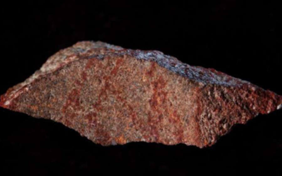 A Blombos Cave with ochre pencil on silcrete stone thought to be the earliest drawing. 
