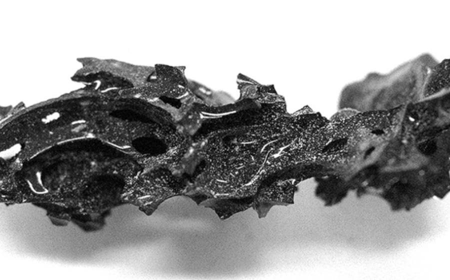 A piece of organic glass discovered within the skull of a man from ancient Herculaneum