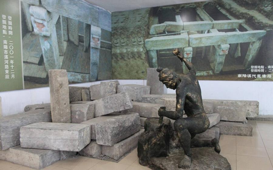 Collection of Han Dynasty tomb bricks, featuring statue of Han stonecutter, on display at Nanyang Museum of Han Dynasty Stone Carving, Henan Province, China