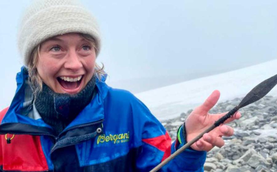 A Secrets of the Ice team member proudly holding up the latest ice patch arrow released by Norway’s melting Langfonne ice patch.Source: Secrets of the Ice