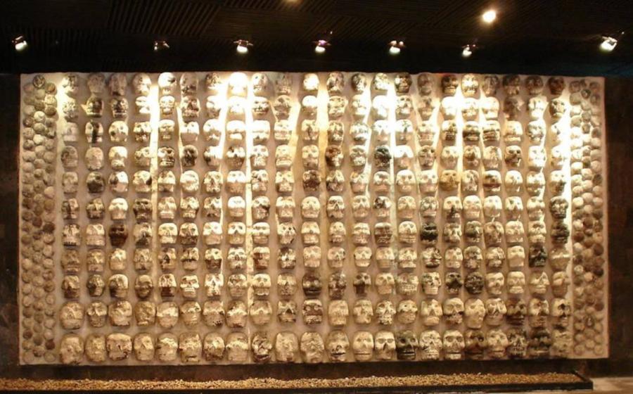 Display of wooden rack filled with skulls, used by Mesoamerican societies (including the Maya) to display the heads of sacrificial victims, at the Templo Mayor Museum in Mexico City. 